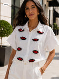 Embellished button up blouse