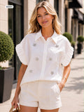Embellished button up blouse with elasticated cuffs